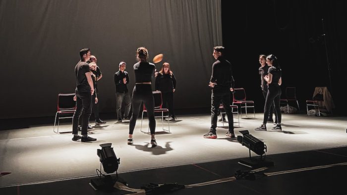 group of people standing on stage
