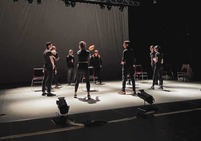 group of people standing on stage